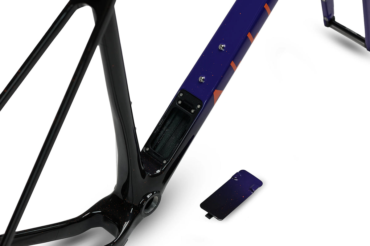 ALLIED ABLE Last Light down tube with the in-frame storage hatch open and its purple-fade cover set beside it, near the bottom bracket