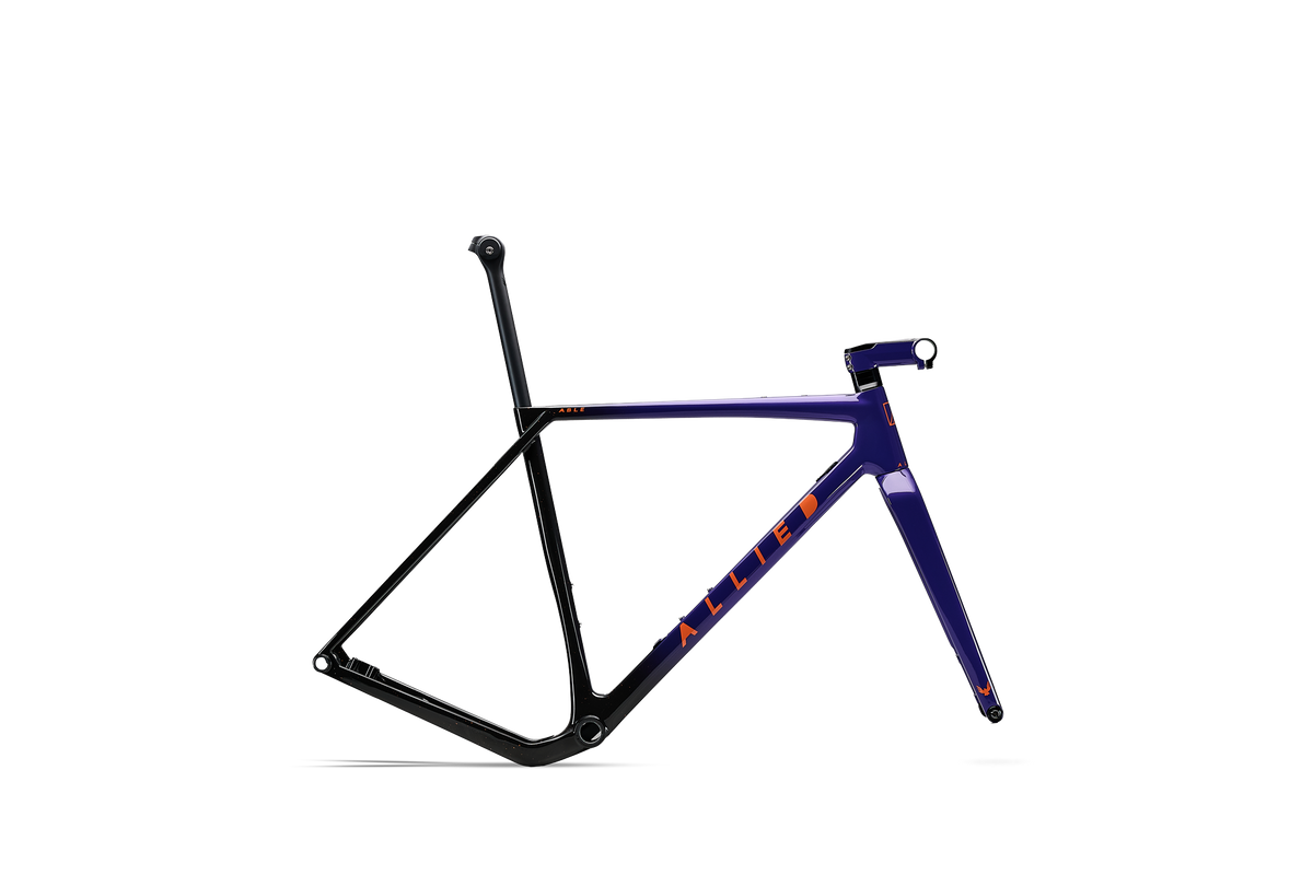 ALLIED ABLE carbon gravel frameset in Last Light paint, a purple-to-black fade with coral splatter, shown with fork, seatpost, and stem