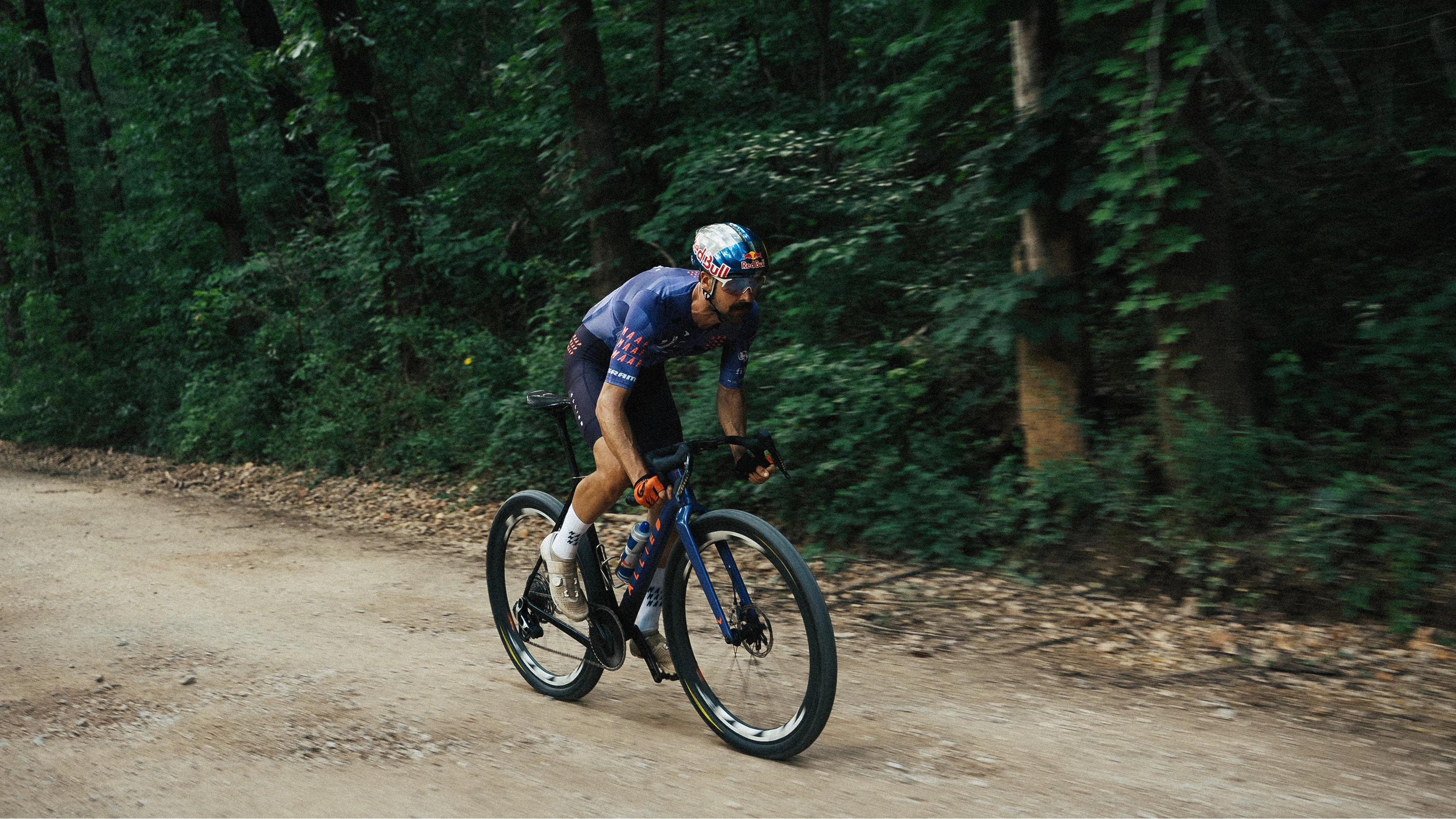 Payson McElveen riding his custom painted ABLE on gravel.