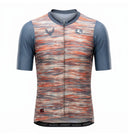 A short-sleeve cycling jersey with a textured, horizontal streaked pattern in orange, red, and gray, featuring solid slate blue sleeves and a full-length front zipper.